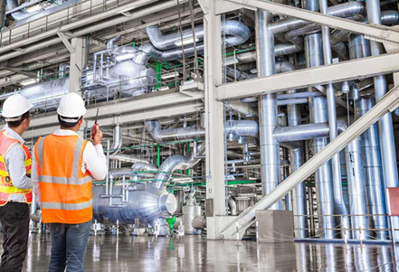 Commissioning engineers walking down a process plant during start-up